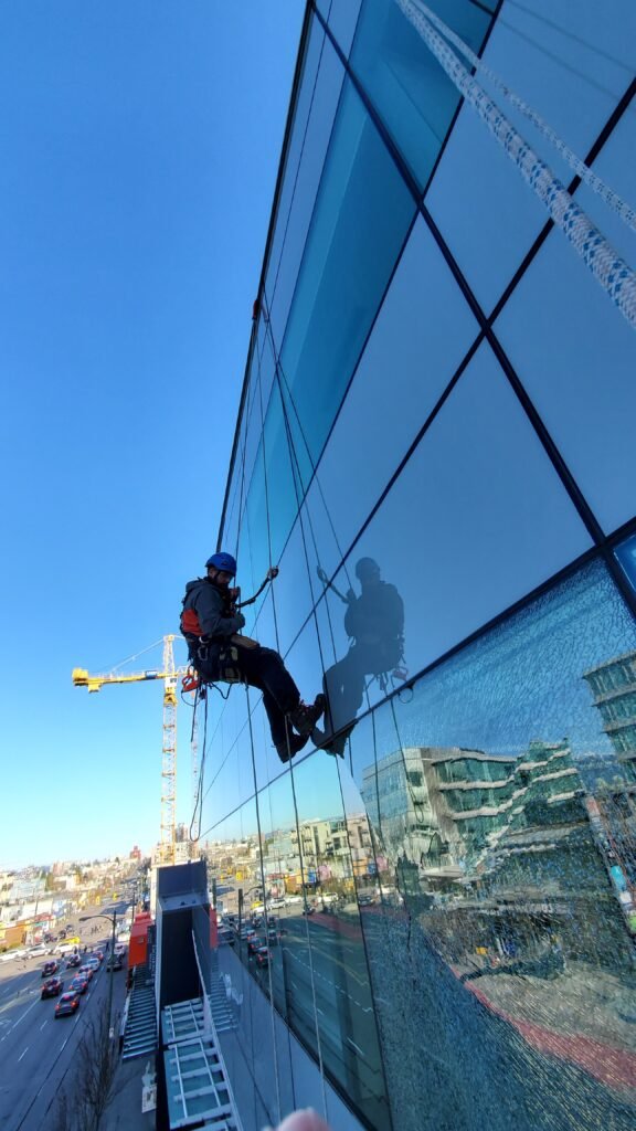 Vent Cleaning 6 hanging off side of building